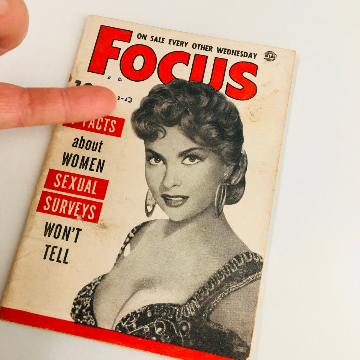Detailed view of VTG Focus Magazine September 2 1953 cover with emphasis on the glamorous woman's portrait and magazine title, addressing intriguing subjects like women's sexual surveys.