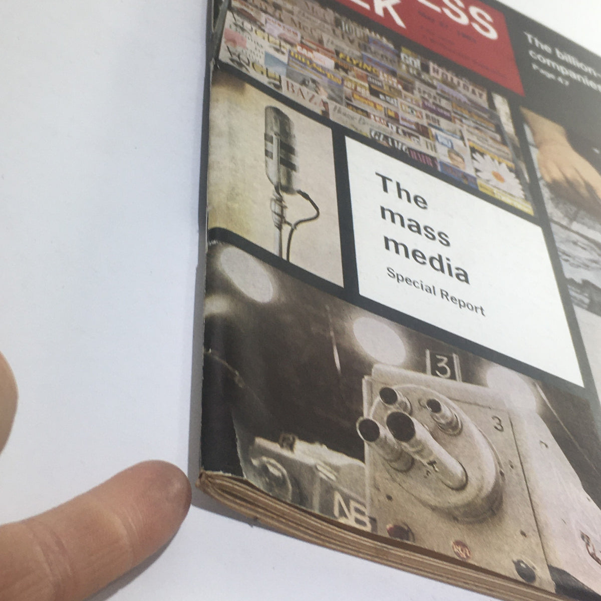 Close-up view of the spine of Business Week Magazine from May 27, 1961, displaying the title The Mass Media and highlighting the magazine's vintage condition.