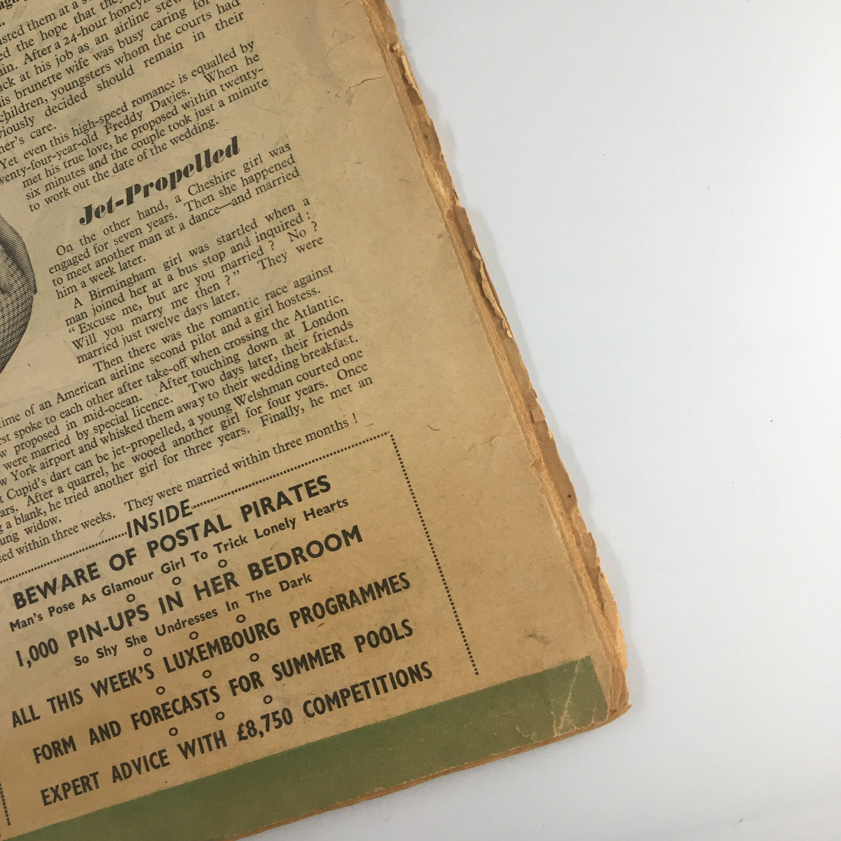 Detail view of the back side of VTG Tit-Bits Magazine June 22 1957, highlighting vintage advertisements and the magazine's condition.