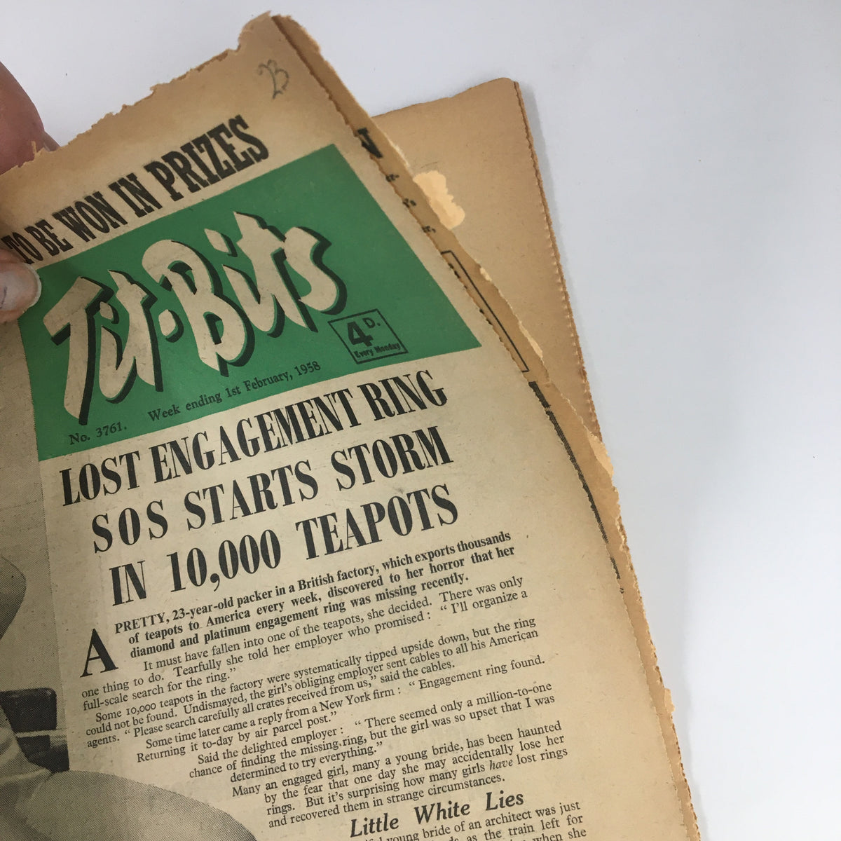 Close-up of the VTG Tit-Bits Magazine February 1, 1958 cover, highlighting the article about a missing engagement ring in 10,000 teapots.
