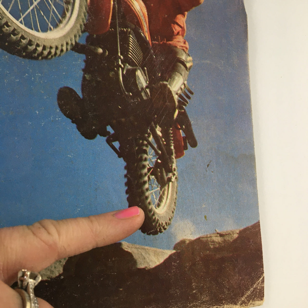 Cycle Magazine March 1977 featuring a motorcyclist performing a stunt on a Can-Am motorcycle, showcasing the Can-Am 175 and 250 models.