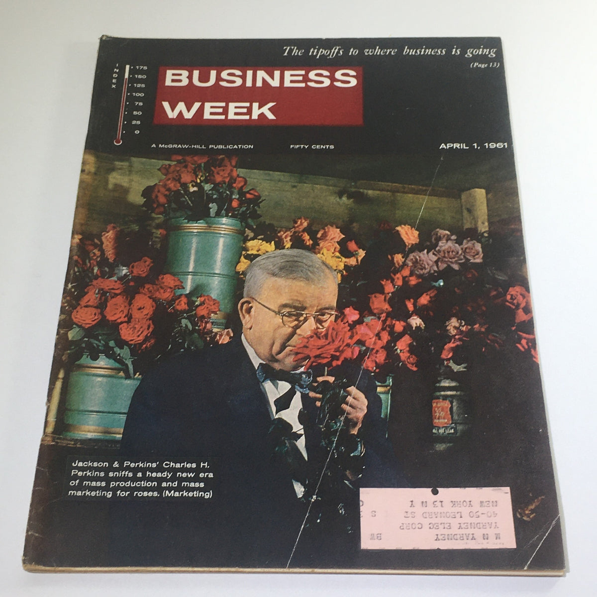 Cover of Business Week Magazine dated April 1, 1961, featuring Jackson & Perkins' Charles H. Perkins surrounded by roses, highlighting mass production and marketing of flowers.