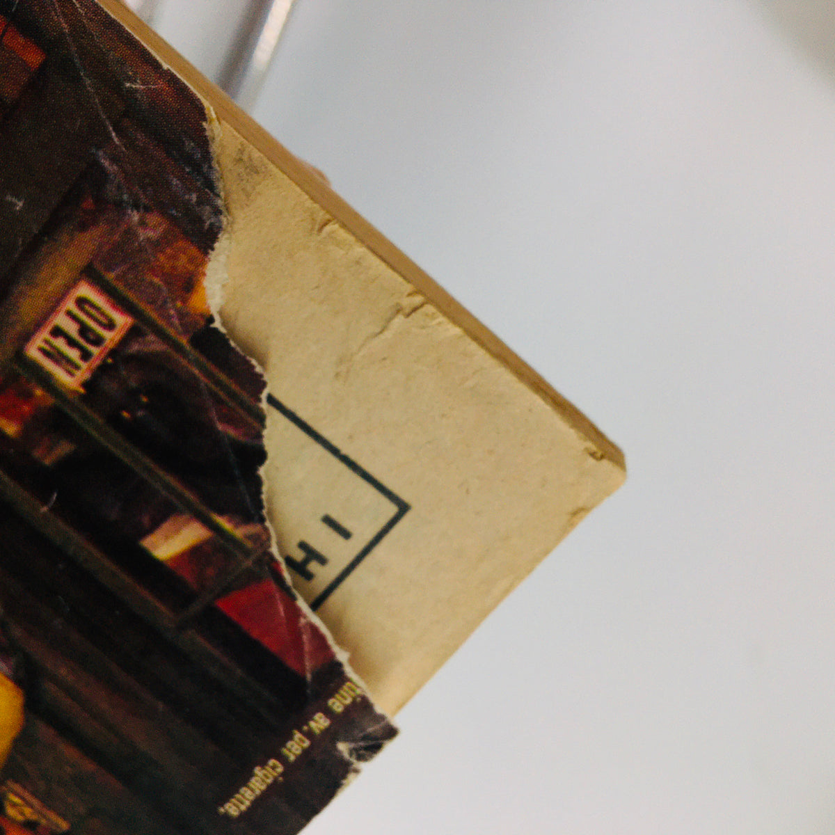 Close-up of the torn top edge of the back cover of the April 1979 Baseball Digest Magazine, showing minor wear indicative of age.