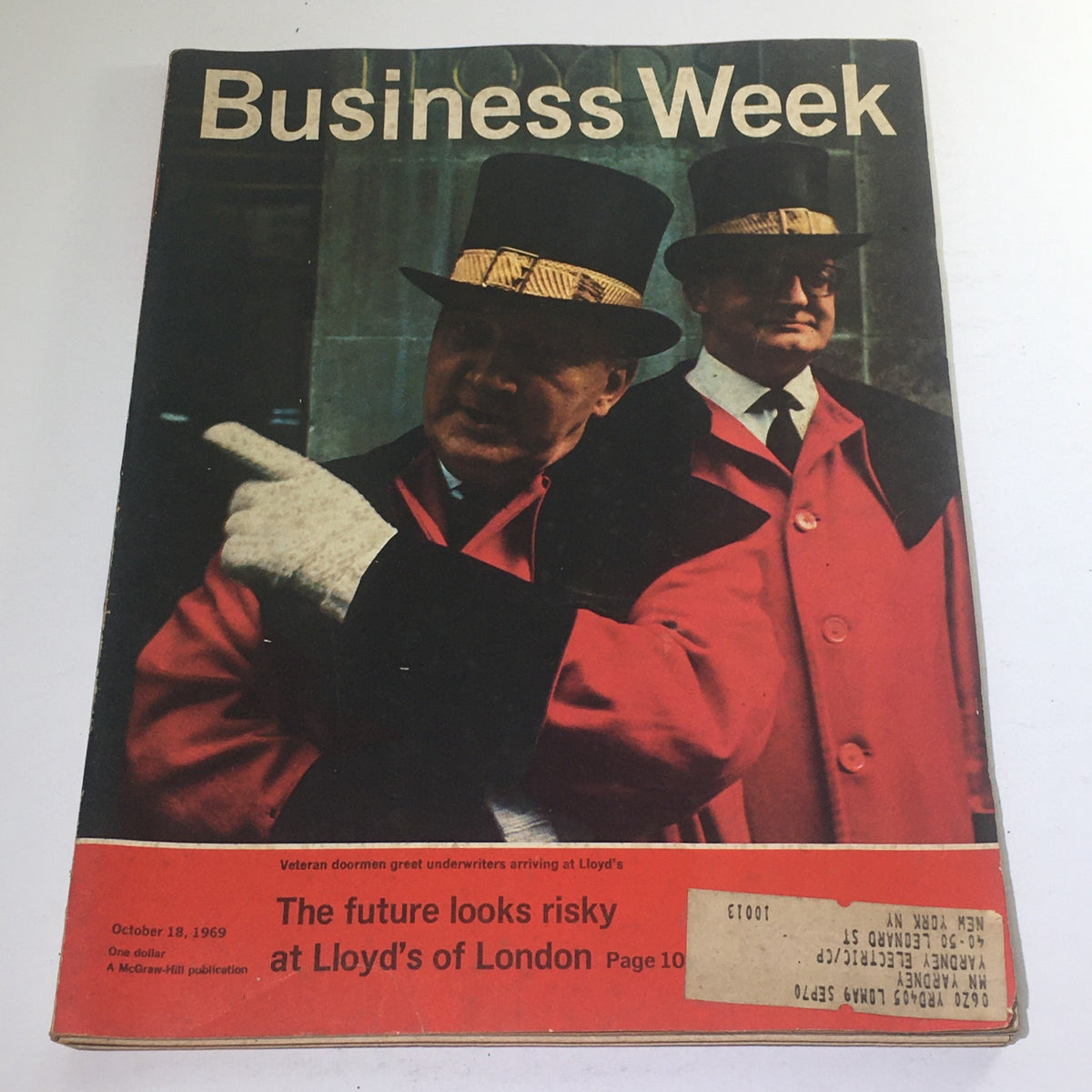 Cover of Business Week Magazine from October 18, 1969, featuring veteran doormen greeting underwriters at Lloyd's of London. The magazine highlights economic themes pertinent to the era's business world.