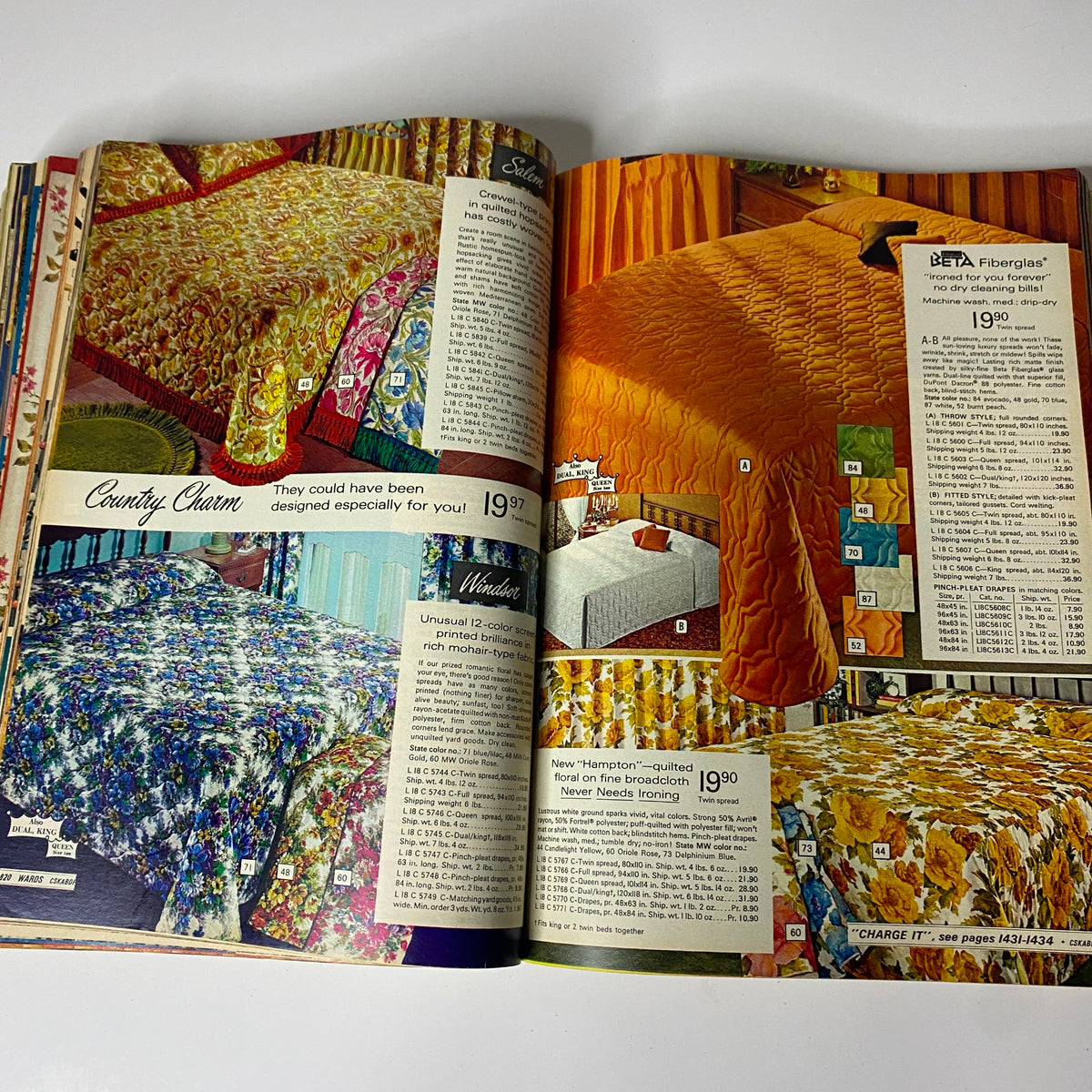 Interior pages showcasing bedding options from the 1969 Montgomery Ward Fall and Winter Catalog, highlighting colorful quilts and pricing.