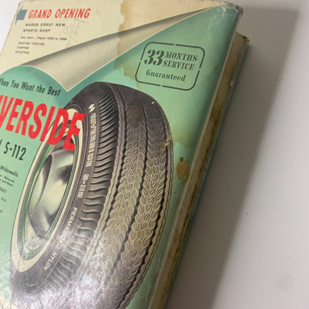 Close-up of the cover of the 1962 Montgomery Ward Spring and Summer Catalog highlighting the Riverside nylon tire with promotional details.