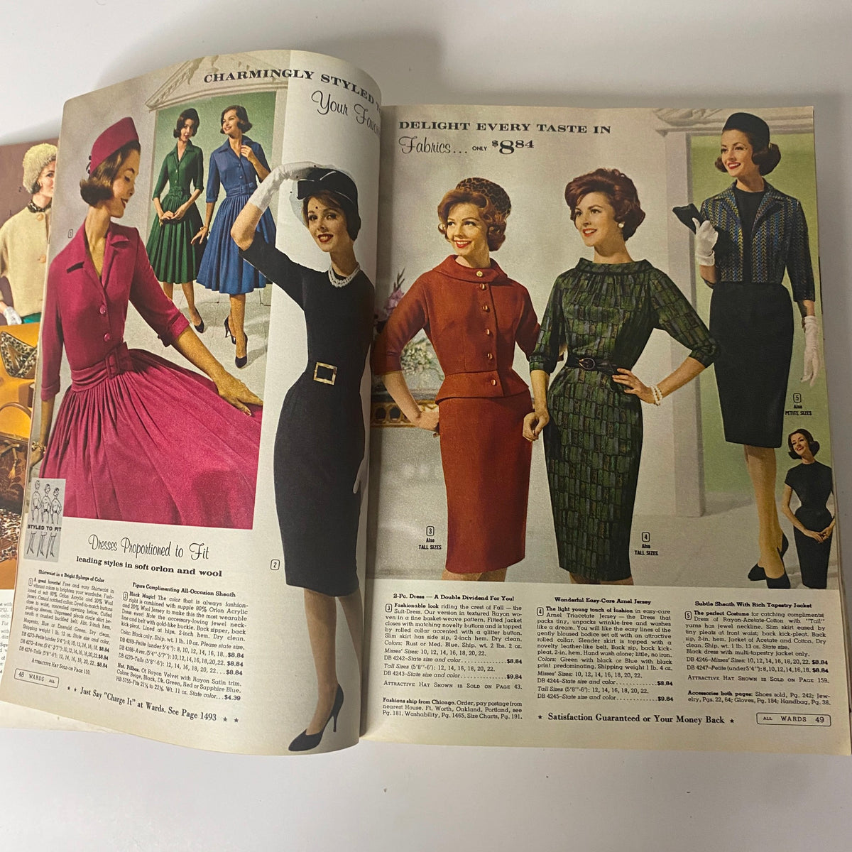 Interior page of the 1961 Montgomery Ward Fall and Winter Catalog, displaying a selection of elegant dresses and formal wear, capturing the essence of early 1960s style.