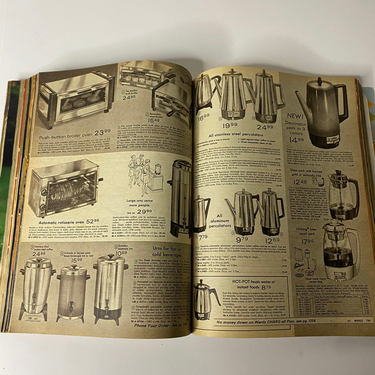 1970 Montgomery Ward Spring and Summer Catalog displaying a variety of kitchen appliances, including ovens and coffee makers, illustrating home goods from the 1970s.
