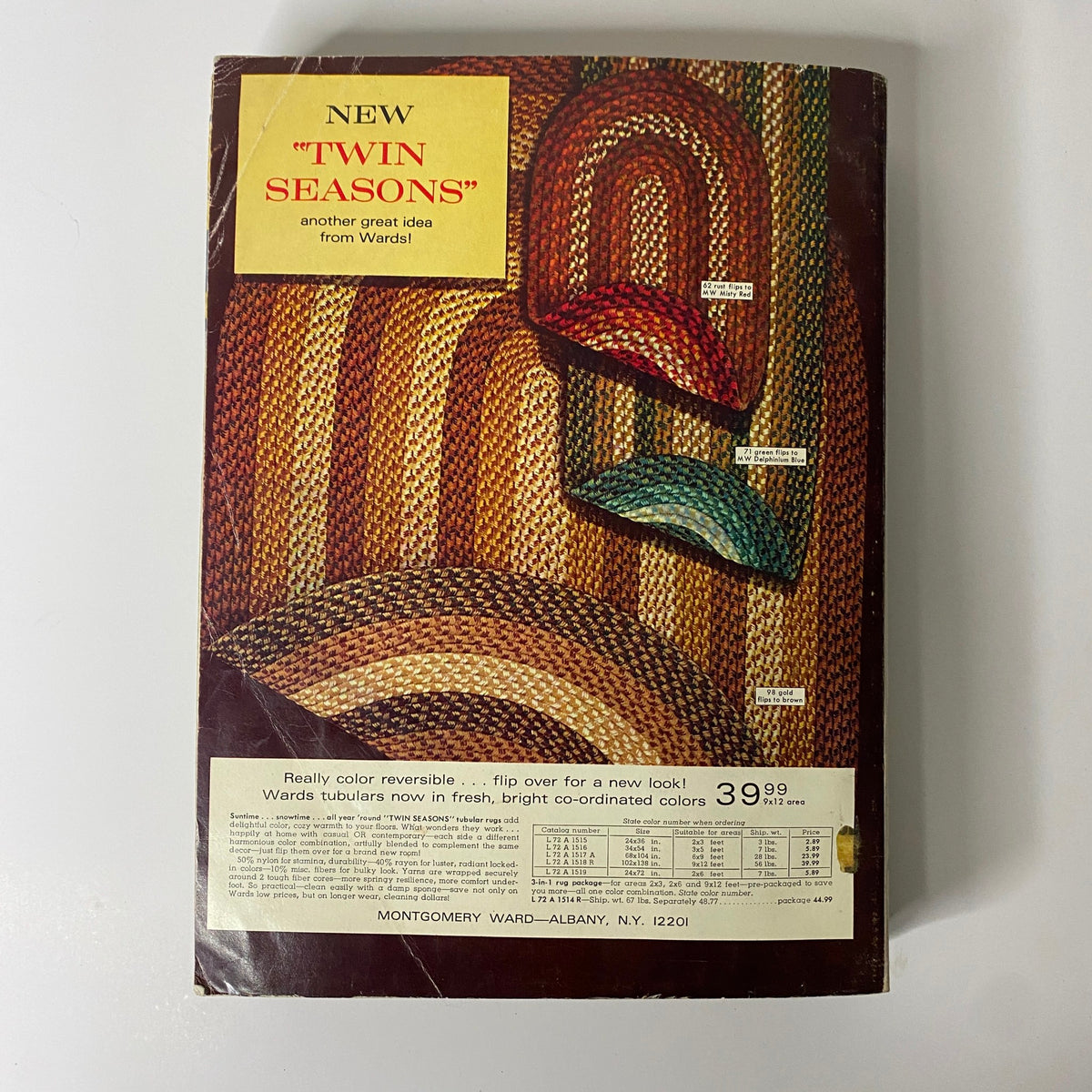 Back cover of the 1970 Montgomery Ward Spring and Summer Catalog featuring colorful braided rugs with a reversible design, exemplifying the home decor aesthetics of the era.