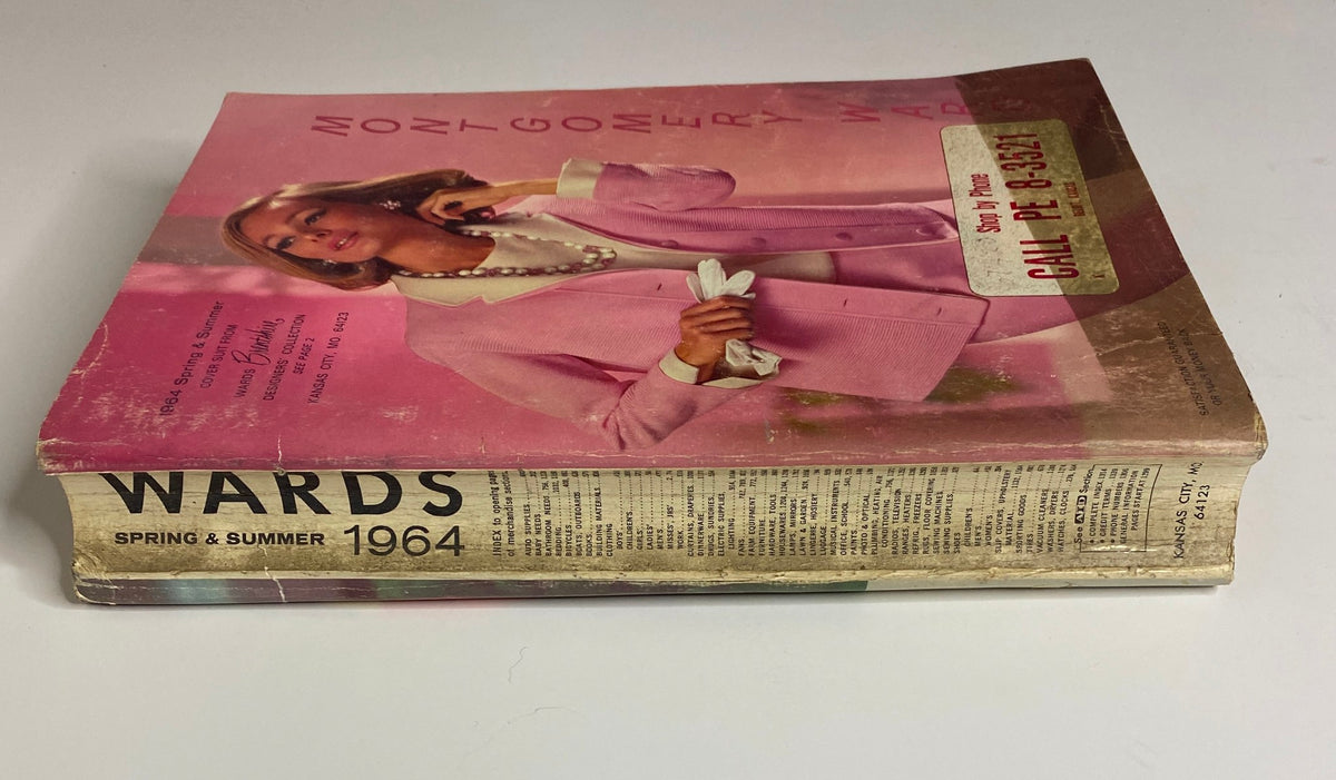 Cover of the 1964 Montgomery Ward Spring and Summer Catalog featuring a fashionable woman in a pink suit and elegant accessories.