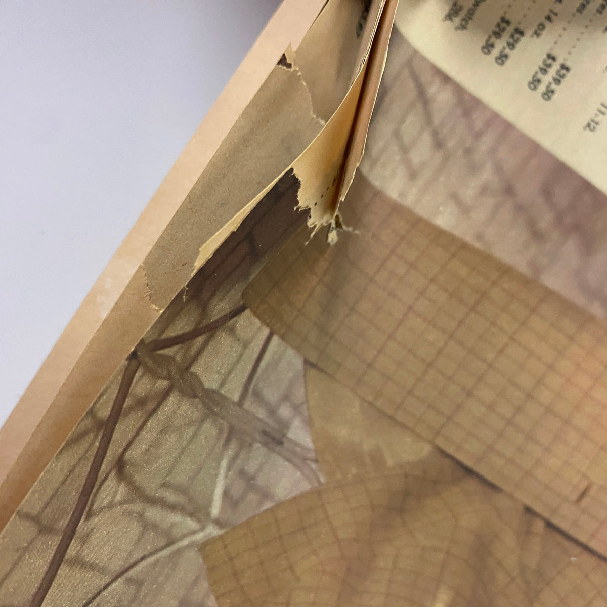 Close-up of the damaged spine of the 1966 Montgomery Ward Spring and Summer Catalog, illustrating the publication's vintage condition.