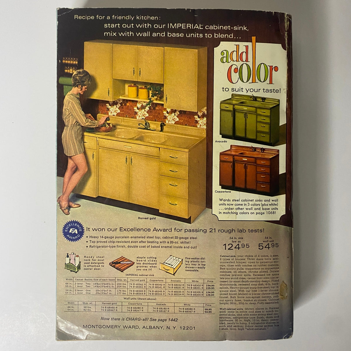 1970 Montgomery Ward Fall and Winter Catalog back cover featuring a kitchen advertisement with a woman using an Imperial cabinet-sink, illustrating color options for kitchen units.