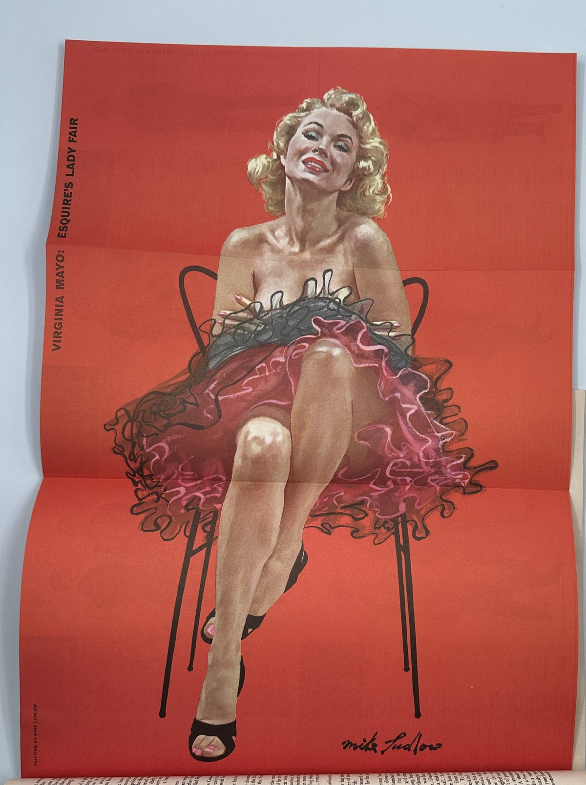 Esquire Magazine October 1955 pinup art of Virginia Mayo, a celebrated actress, depicted in a vibrant red dress.