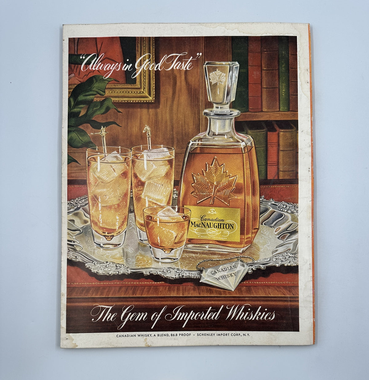 Esquire Magazine November 1955 Pumpkin Model Cover with an advertisement for MacNaughton whiskey, depicting an elegant decanter and glasses, representing fine taste.