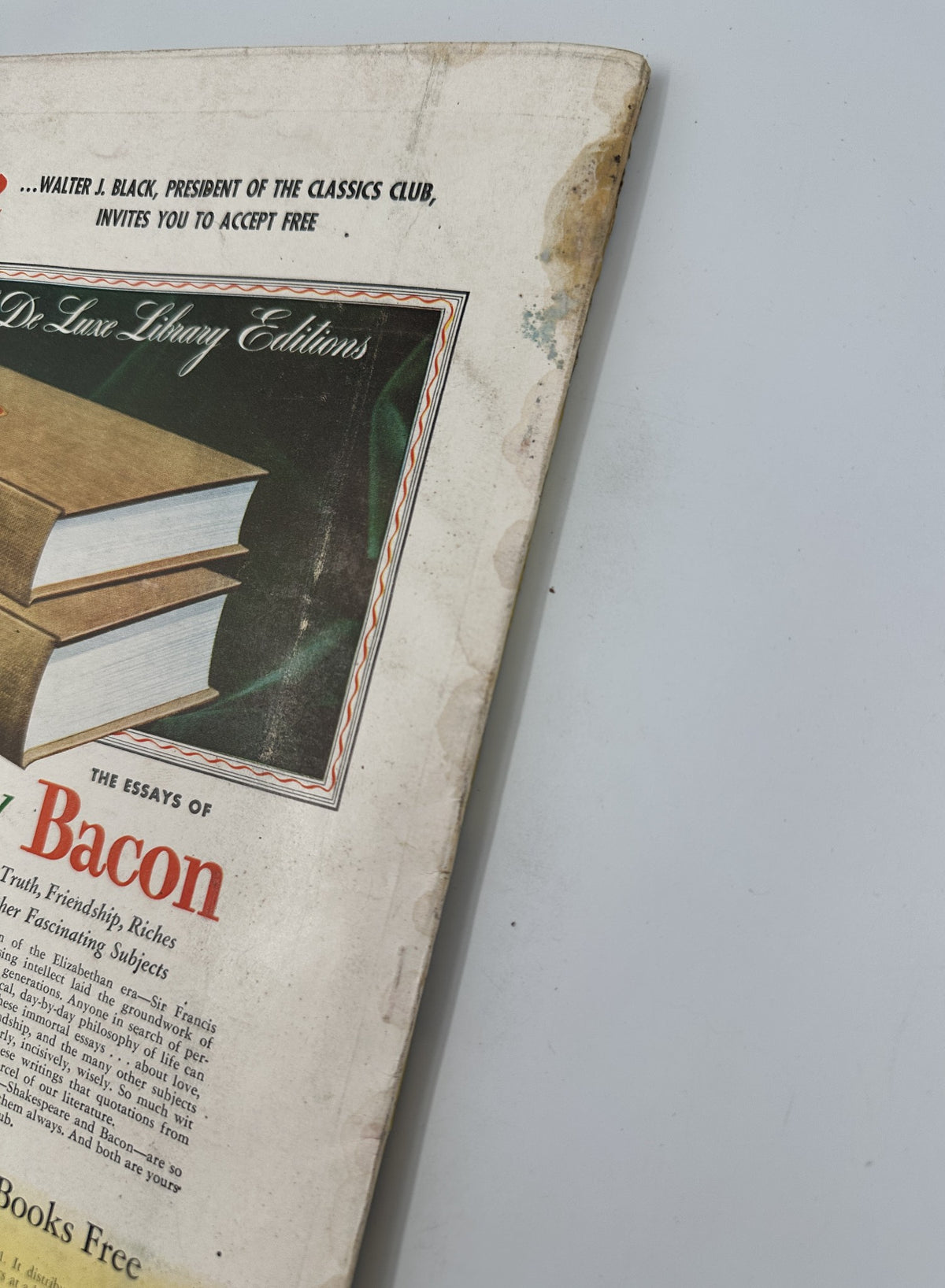 Close-up of the back cover of Esquire Magazine September 1955, showing wear and tear with watermarks. Includes featured advertisements for Dr. Lulow Library Editions and a promotion for the Essays of Bacon.