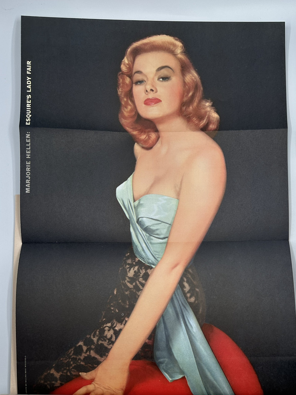 Pinup feature of Marjorie Hellen from Esquire Magazine February 1956, highlighting her glamour in a stylish dress.