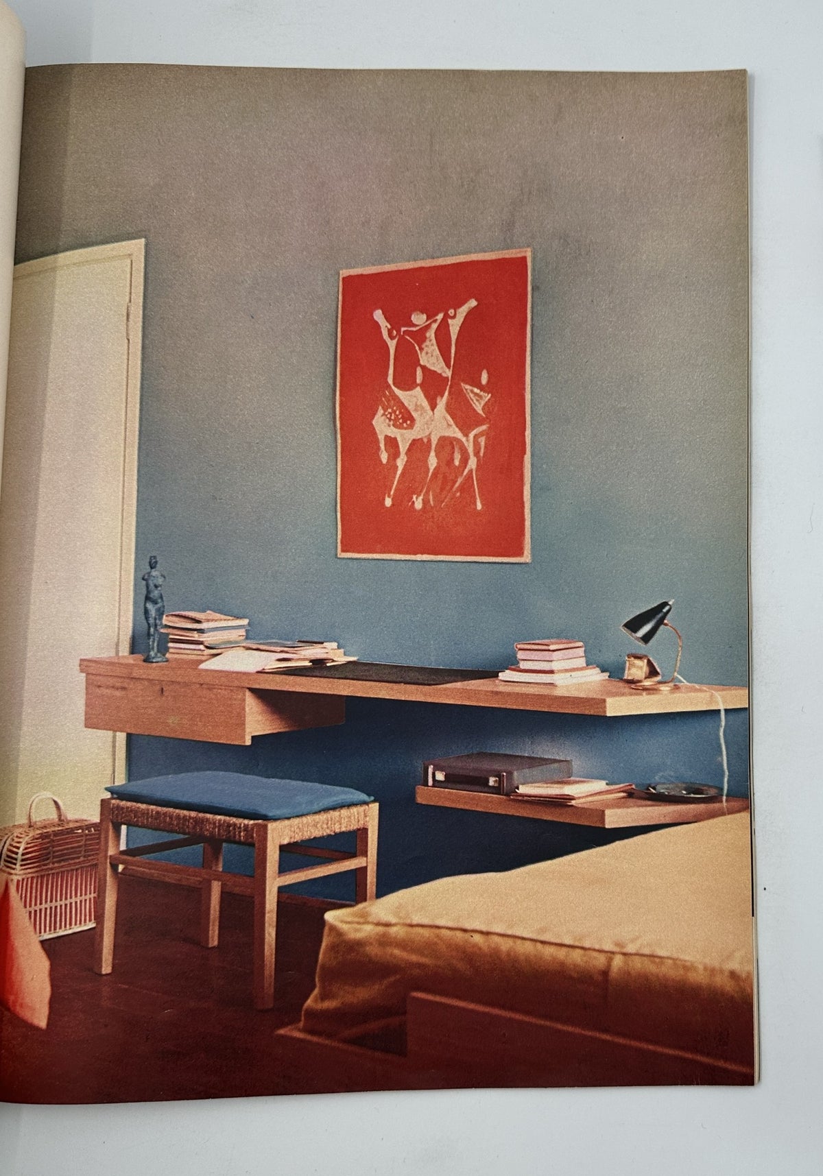 Interior design page from Esquire Magazine August 1956 showcasing a stylish room with modern furniture and artwork, emphasizing contemporary aesthetics.