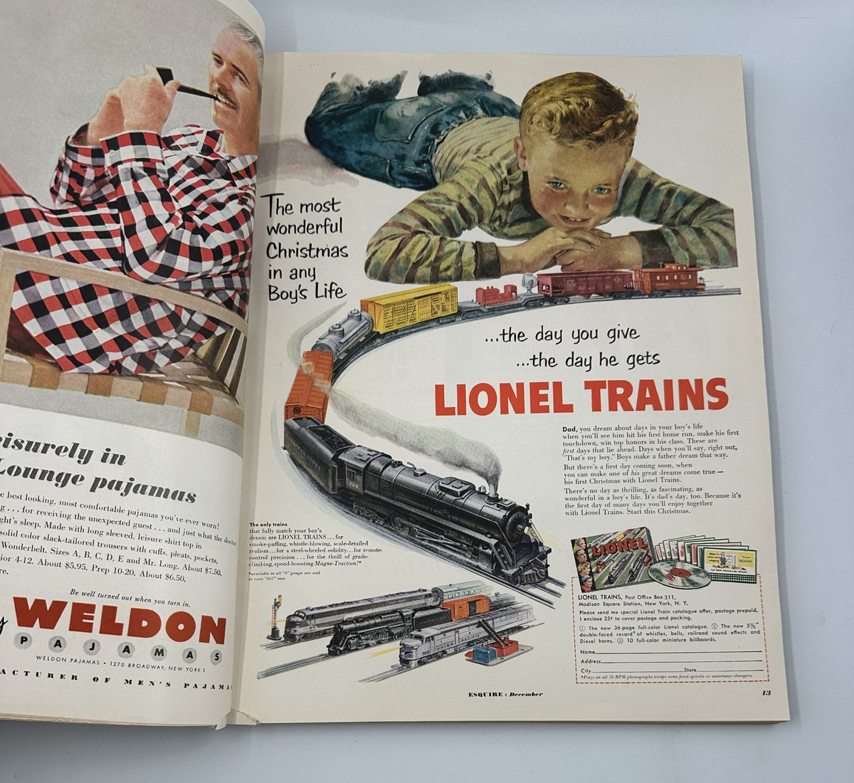 Esquire Magazine December 1951 featuring a vintage advertisement for Lionel Trains with a young boy enthusiastically watching the train set, perfect for holiday gift ideas.
