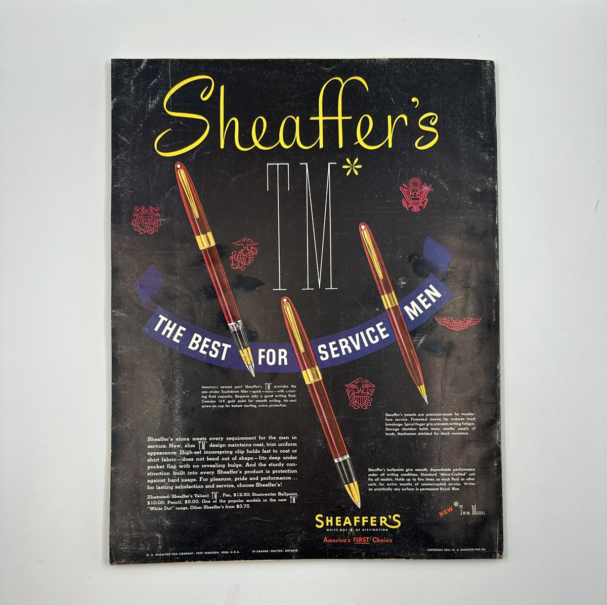 Esquire Magazine June 1951 includes an advertisement for Sheaffer's pens, highlighting their appeal to service men with a bold design. Perfect for enthusiasts of retro office supplies and advertising.