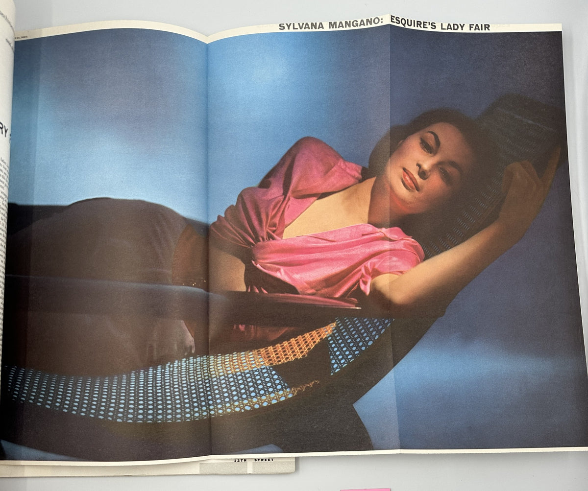 Interior spread of Esquire Magazine July 1954 showcasing Sylvana Mangano in a glamorous pose for 'Esquire’s Lady Fair' section.
