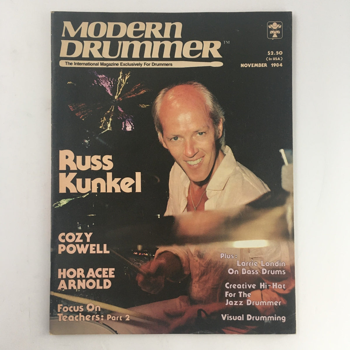 Modern Drummer Magazine November 1984 issue featuring Russ Kunkel on the cover along with Cozy Powell and Horacee Arnold, highlighting key drumming techniques and artists from the 1980s.