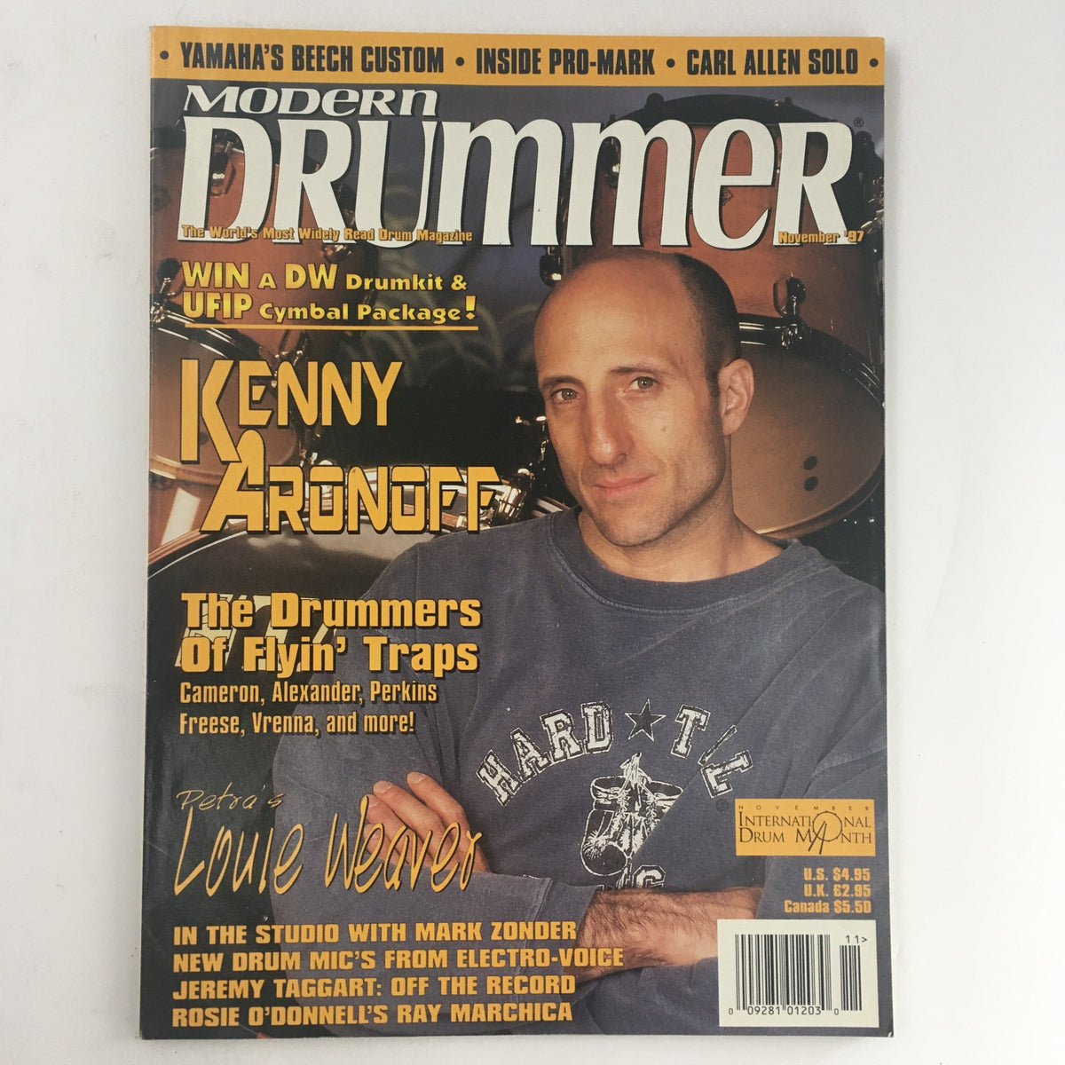 Cover of Modern Drummer Magazine from November 1997 featuring Kenny Aronoff. The issue highlights 'The Drummers of Flyin' Traps' and includes articles about various drummers, showcasing the vibrant drumming culture of the late '90s.