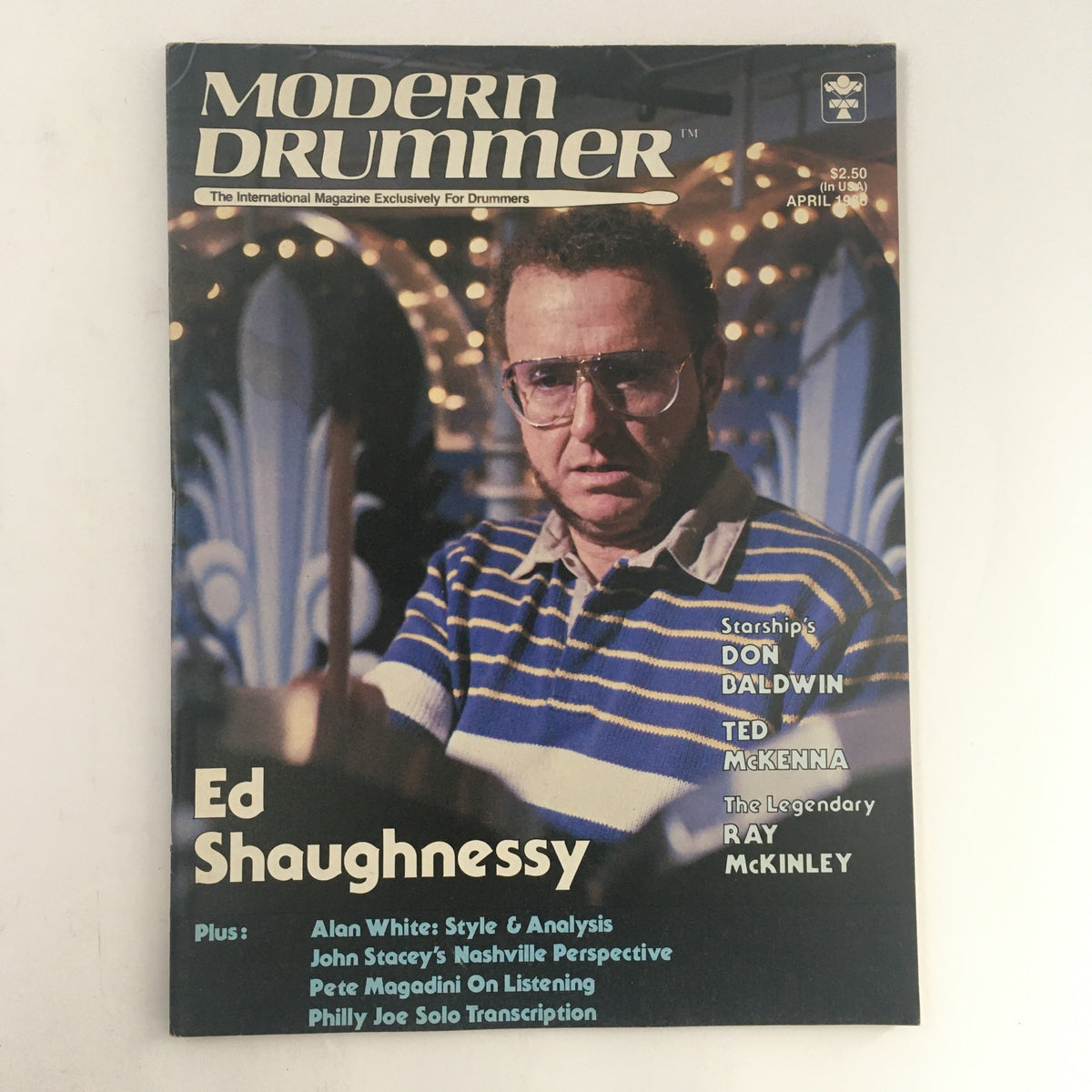 Cover of Modern Drummer Magazine April 1986 featuring Ed Shaughnessy, Don Baldwin, and Ted McKenna. This edition focuses on the artistry and techniques of drumming, highlighting influential drummers from the 1980s.