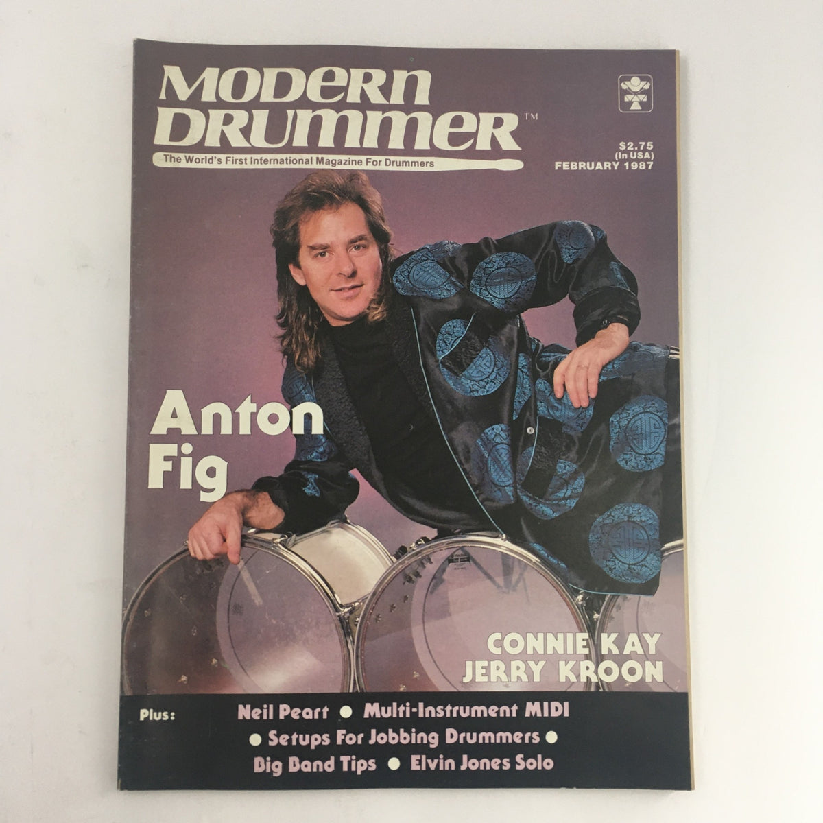 Cover of Modern Drummer Magazine February 1987 featuring Anton Fig with a backdrop of drums, also highlighting Connie Kay and Jerry Kroon.