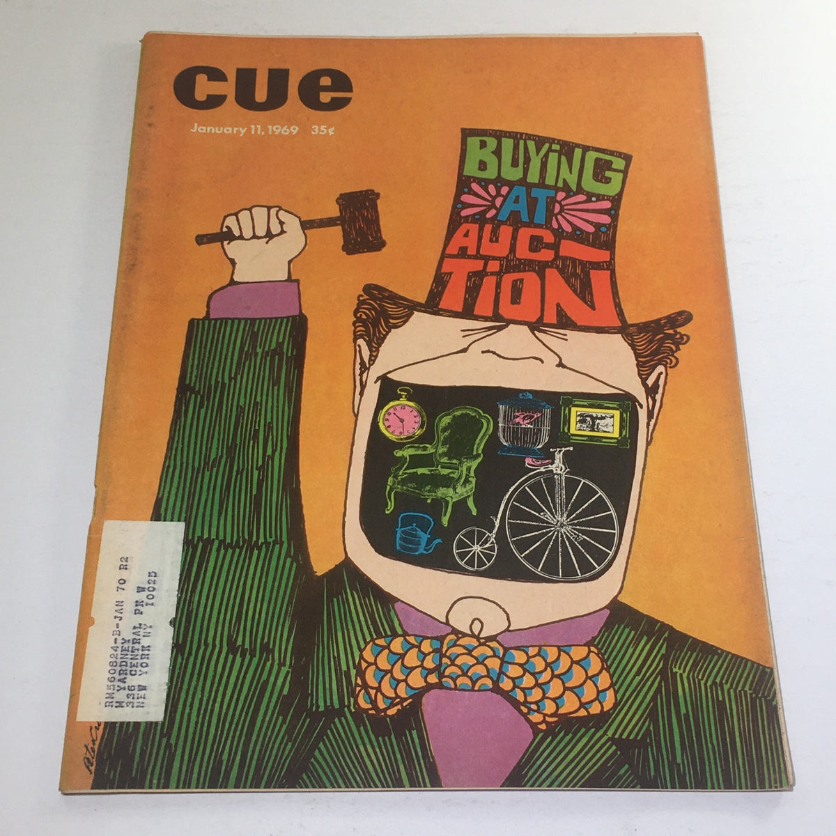Cover of Cue Magazine from January 11, 1969, featuring a colorful illustration of a man in a top hat holding a gavel with the title 'Buying At Auction'. The artwork showcases various auction items inside the man's head, reflecting the magazine's focus on auction practices of the late 1960s.