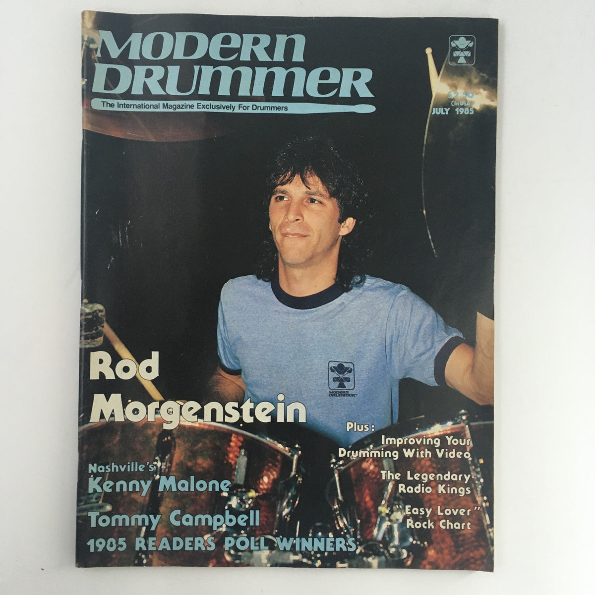 Cover of Modern Drummer Magazine, July 1985, featuring Rod Morgenstein, with mentions of Kenny Malone and Tommy Campbell as well as topics like improving drumming with video and the 1985 Readers Poll winners.