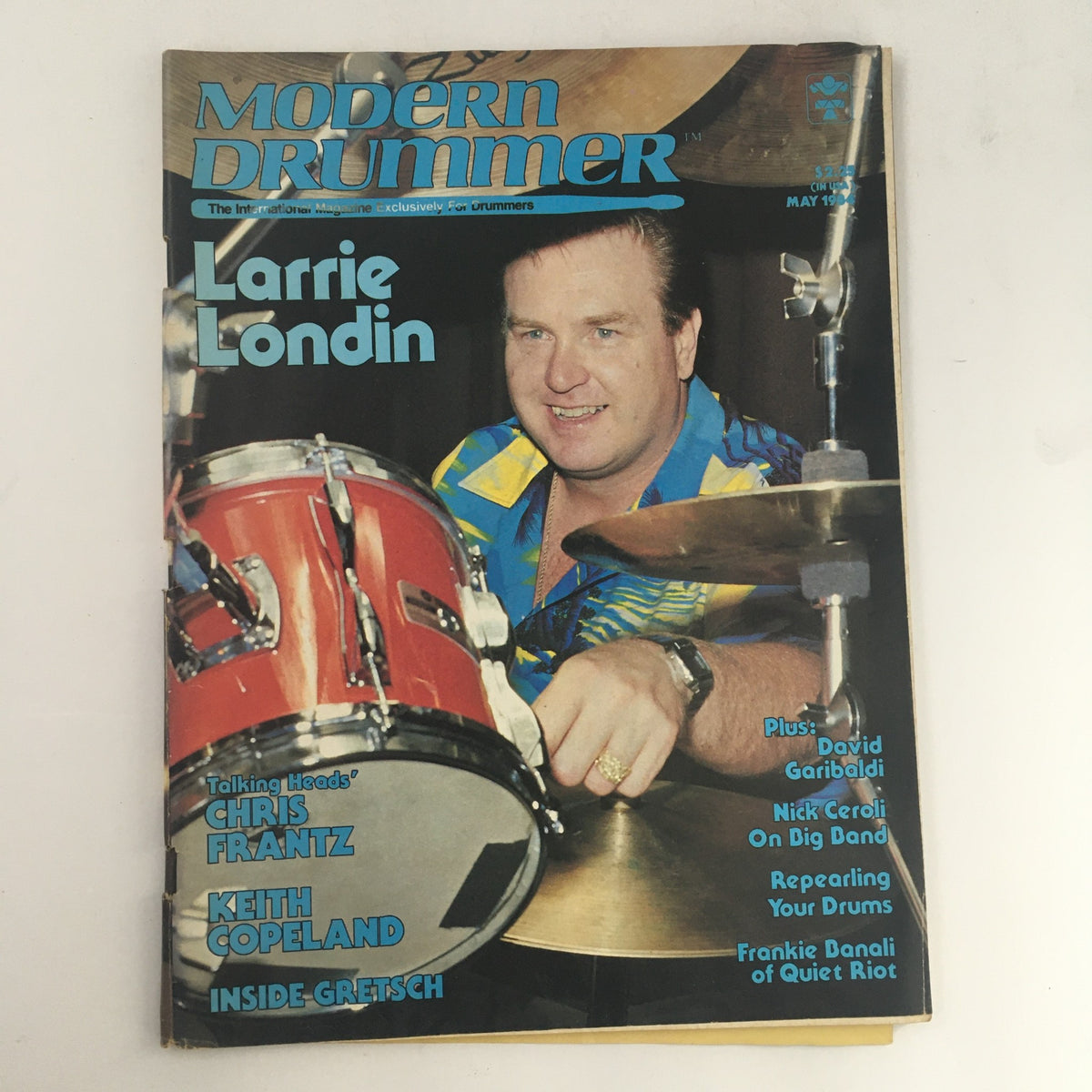 Modern Drummer Magazine cover from May 1984 featuring Larrie Londin, along with mentions of Chris Frantz and Keith Copeland. The vibrant design showcases Londin playing the drums, reflecting the music culture of the 1980s.
