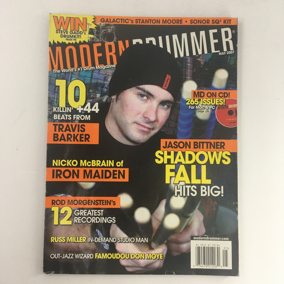 Cover of Modern Drummer Magazine May 2007 featuring prominent drummers Travis Barker, Jason Bittner, and Nico McBrain. The magazine highlights music and drumming culture with insights from notable musicians.