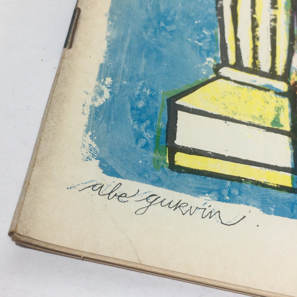 Close-up of the signature 'Abe Gurvin' on the cover of Cue Magazine from February 22, 1969, highlighting the artistic details and texture of the vintage magazine.