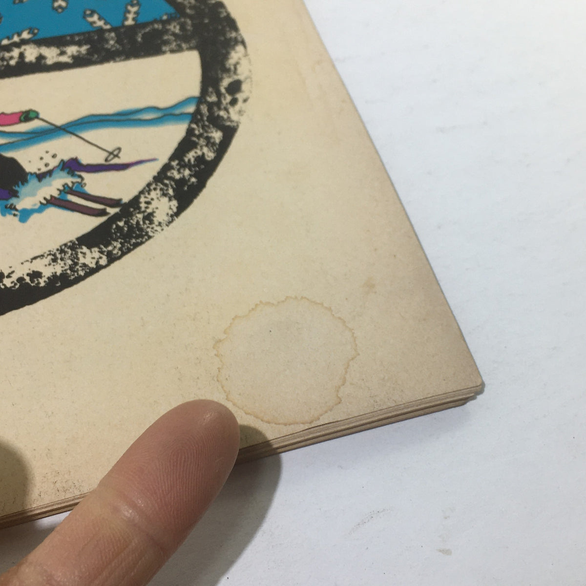 Detailed view of the back cover of Cue Magazine: November 22, 1969, highlighting a minor watermark and vintage wear, characteristic of its used condition.