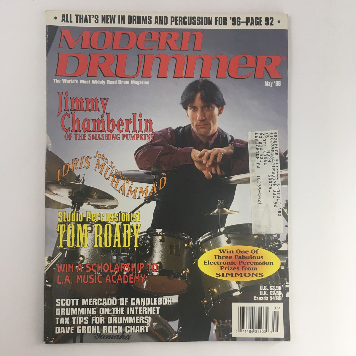 Cover of Modern Drummer Magazine May 1996 featuring Jimmy Chamberlin of The Smashing Pumpkins, Idris Muhammad, and Tom Roady. Highlights include drumming techniques and a chance to win scholarships.