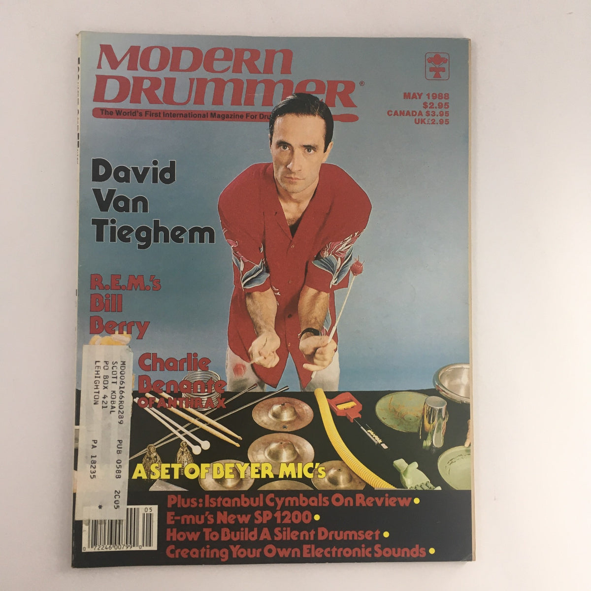 Modern Drummer Magazine May 1988 featuring David Van Tieghem, R.E.M.'s Bill Berry, and Charlie Benante. Vintage music magazine cover showcasing prominent drummers of the late 80s, including drum equipment and articles relevant to the era.