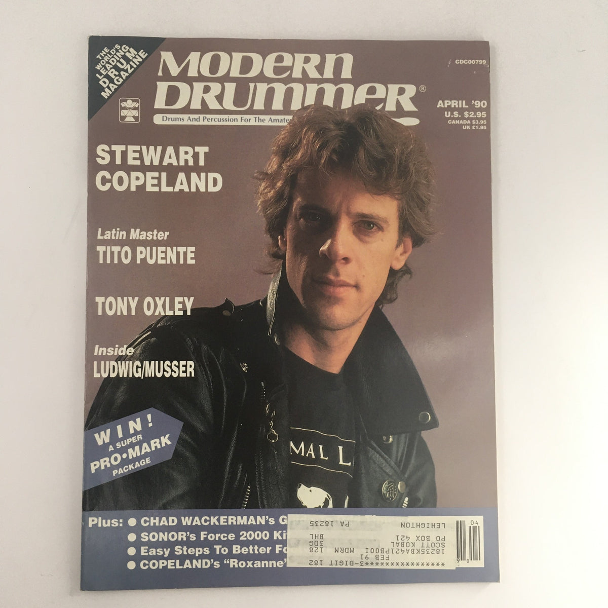 Modern Drummer Magazine April 1990 cover featuring Stewart Copeland, Tito Puente, and Tony Oxley. The magazine showcases drumming culture with a focus on influential musicians.