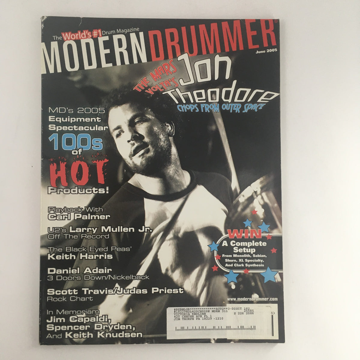 Cover of Modern Drummer Magazine from June 2005 featuring Jon Theodore, Carl Palmer, and Larry Mullen Jr. This issue highlights their contributions to drumming and includes interviews and insights.