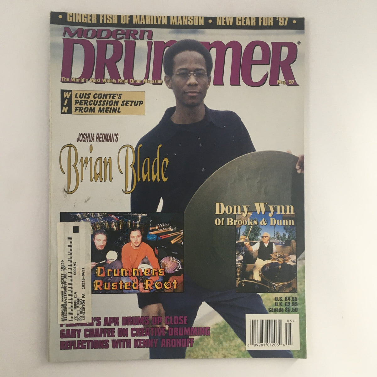 Cover of Modern Drummer Magazine May 1997 featuring Brian Blade and Dony Wynn. The magazine highlights the drummers and includes the band Rusted Root, showcasing vibrant design elements relevant to drumming enthusiasts.