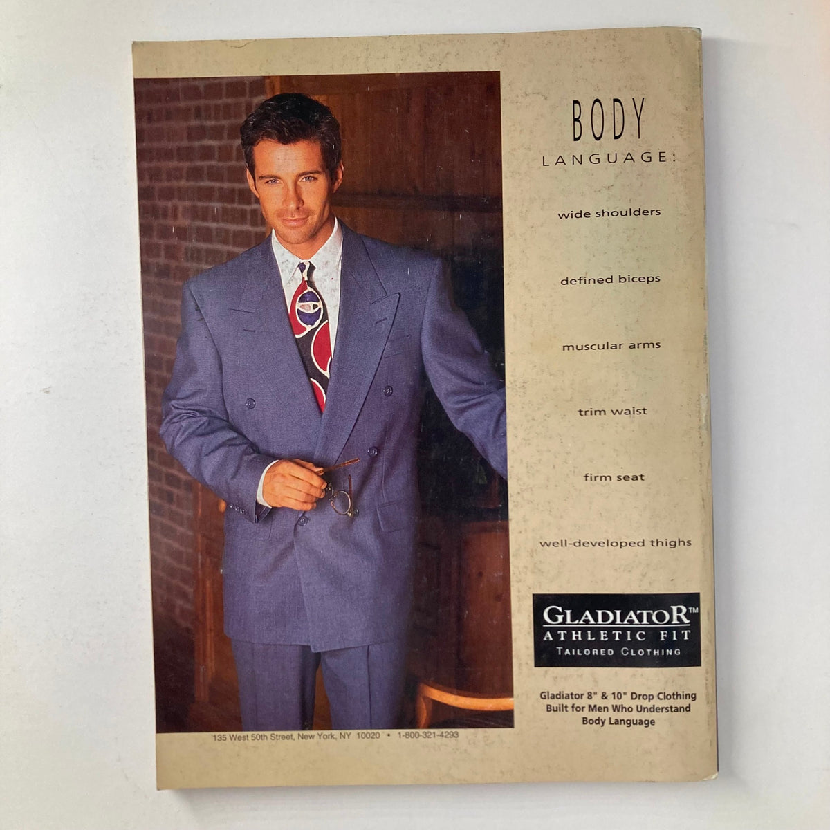 Back cover of Joe Weider's Muscle & Fitness Magazine March 1992, showcasing a tailored men's suit advertisement with emphasis on athletic fit.
