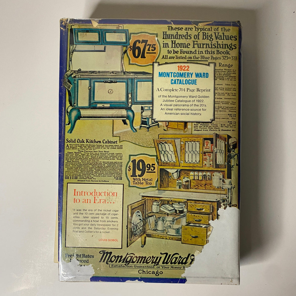 1922-1923 Montgomery Ward Fall and Winter Catalog No. 97 cover page featuring home furnishings and a kitchen cabinet, representing the retail trends of the 1920s.