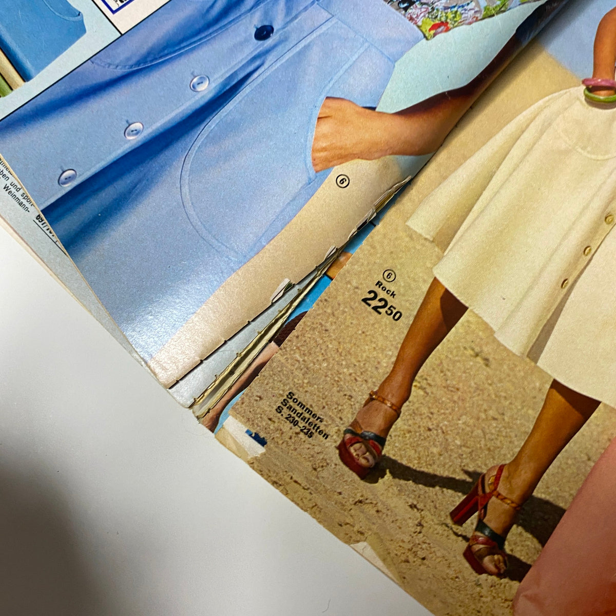 1975 Neckermann Spring and Summer Catalog showcasing women's fashion featuring a light blue outfit and a white skirt, with price details indicated.