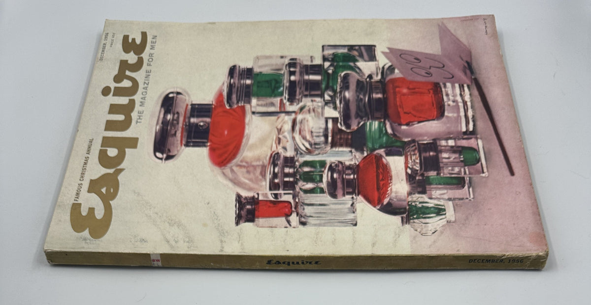 Esquire Magazine December 1956 cover highlighting an artistic arrangement of colored glass perfume bottles.