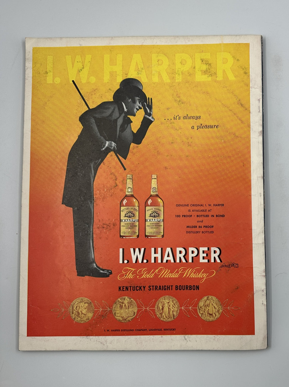 I.W. Harper Whiskey advertisement in Esquire Magazine June 1956 Silvana Pampanini Foldout Antique Cars w Pinup. The image highlights the premium bourbon featuring a silhouette of a tipper wearing a top hat, emphasizing the brand's classic and sophisticated style.