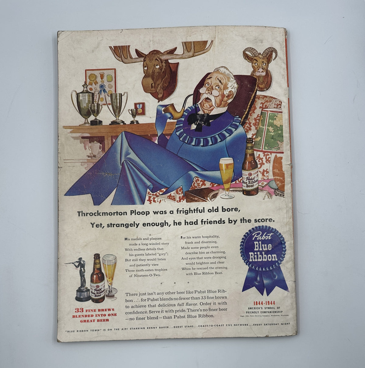 Esquire Magazine January 1945 highlights the back cover illustration with a humorous character, Throckmorton Ploop, promoting Pabst Blue Ribbon beer with trophies and a relaxing setting, reflecting post-war America.