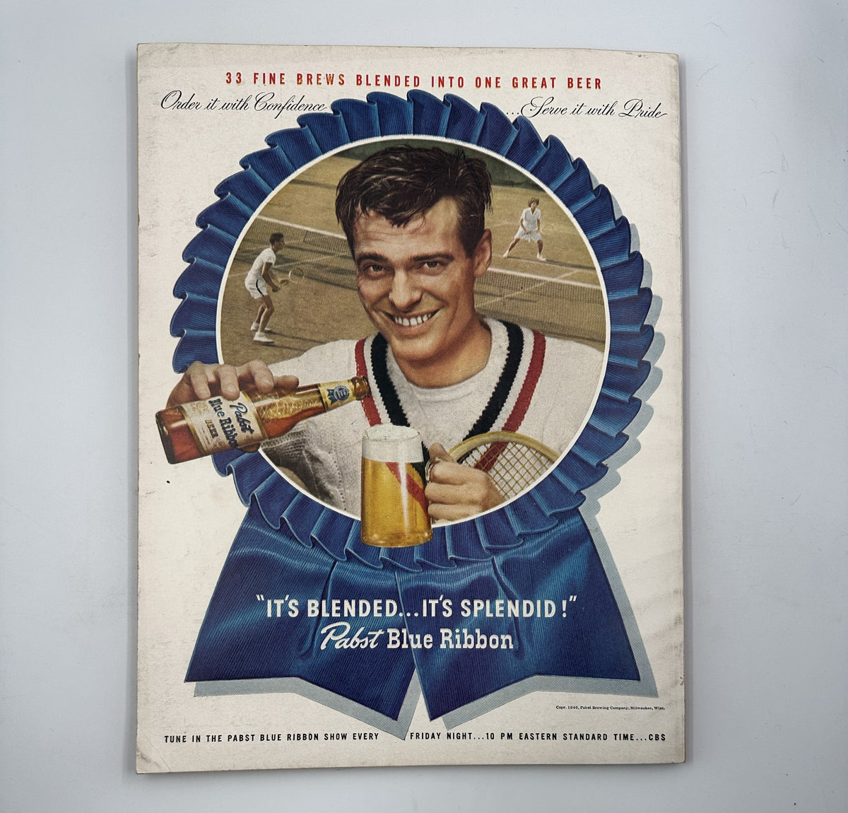 Esquire Magazine July 1946 advertisement for Pabst Blue Ribbon Beer, featuring a smiling man holding a beer and a glass, promoting a show event.