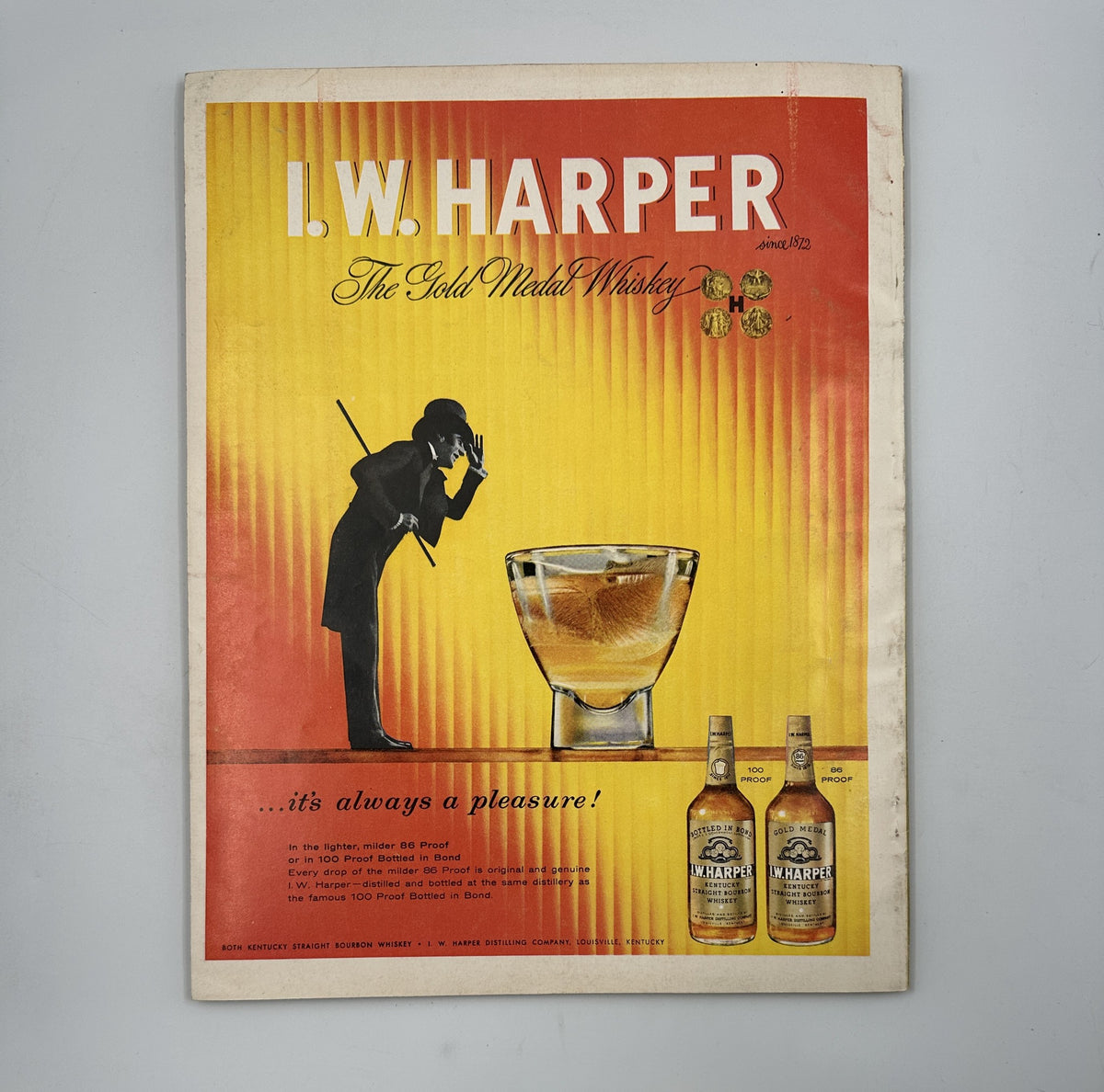 Esquire Magazine August 1957 showcasing a vibrant advertisement for I.W. Harper whiskey, emphasizing the enjoyment and elegance of the drink.
