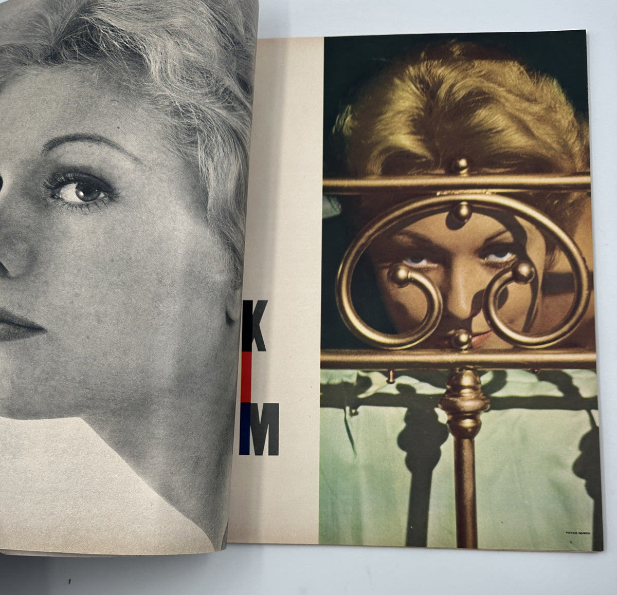 Inside spread of Esquire Magazine February 1957 showcasing a glamorous female model posing behind a decorative bedpost, capturing the allure and fashion of the time.