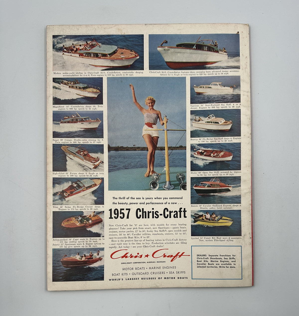 Vintage advertisement from Esquire Magazine March 1957 for Chris-Craft boats, showcasing various motorboats with a woman holding a rope, underlining the brand's elegance and appeal.