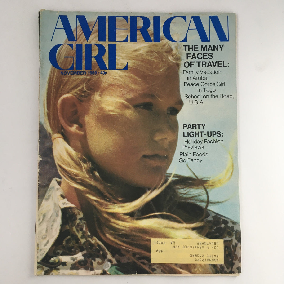 Cover of American Girl Magazine November 1969, featuring the headline 'The Many Faces of Travel' alongside 'Party Light-Ups', showcasing a girl with long hair.